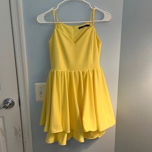 A tiered, yellow cocktail/homecoming dress with sweetheart neckline